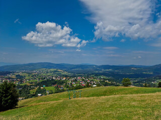 Fototapeta na wymiar View from Ochodzita peak in Beskidy Mountains on village Koniakow Poland