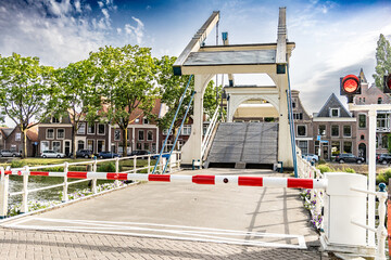 Fototapeta na wymiar Weesp, Netherlands, June 18th, 2022: A drawbridge across a canal in the Netherlands