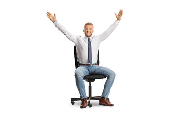 Happy man sitting in an office chair and raising arms