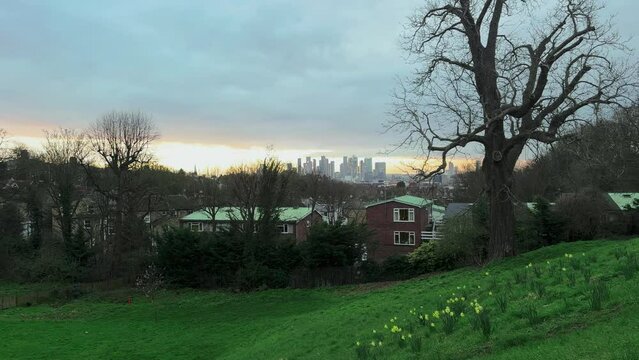 A view of Canary Wharf, the financial centre of London, at sunset in spring