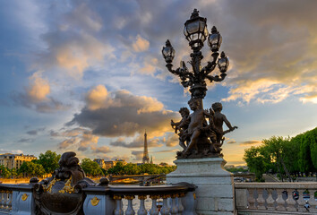 Street lantern on the bridge of Alexander III with the Eiffel Tower in the background at sunset in Paris, France - 751837977