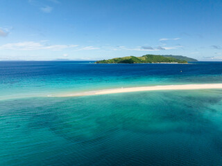 Sandbar with clear turquoise water and waves. Bon Bon Sandbank. Romblon Island. Romblon, Philippines.