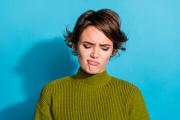 Photo of sad upset girl wear khaki clothes bad mood conflict trouble isolated on cyan color...