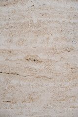 Textured surface with patterns resembling natural materials like wood. Rough surface with visible grains and horizontal lines. Concept of material and planch