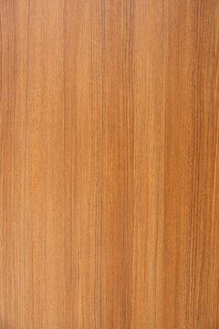 Sleek, smooth and glossy surface with patterns of polished and lacquered wood. Lnear streaks of varying shades of brown creating harmonious and elegant aesthetic
