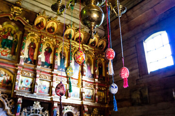 Easter decoration in the church. Easter eggs hang in the church against the background of icons.