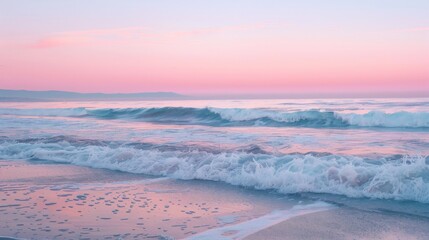 Sunset at the beach with calm waves and pastel sky