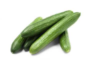 Many long fresh cucumbers isolated on white