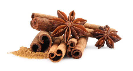 Dry aromatic cinnamon sticks, powder and anise stars isolated on white