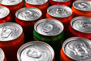 Energy drink in wet cans, closeup. Functional beverage