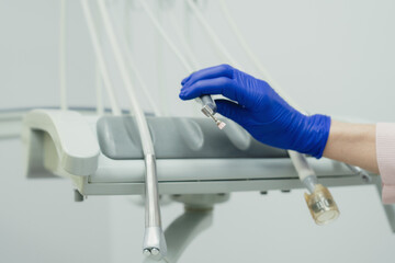 Dental doctor treating a male patient in hospital.