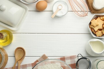 Frame of many different products on white wooden table, flat lay. Space for text