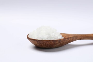 Fototapeta na wymiar Natural salt in wooden spoon isolated on white