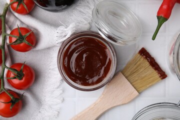 Marinade in jar, ingredients and basting brush on white tiled table, flat lay