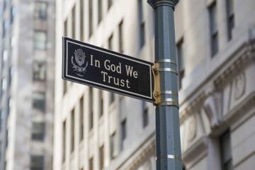 Street sign on Broadway in New York City. "In God We Trust"

