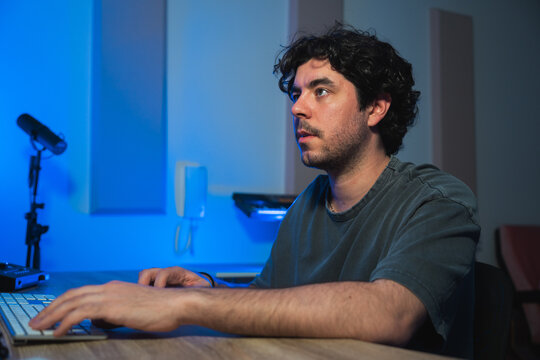 Concentrated man working in a sound studio session