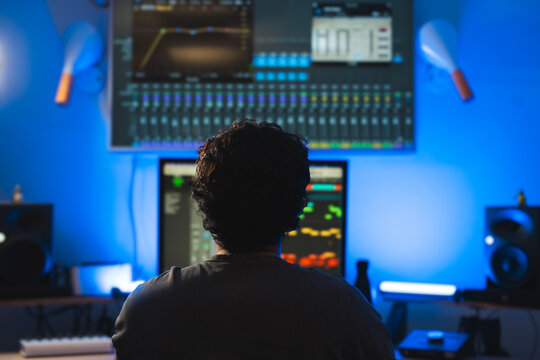 Music Producer Working in a Modern Sound Studio
