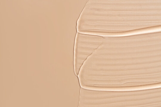 Smooth Foundation Swatches and Serum on Nude Background