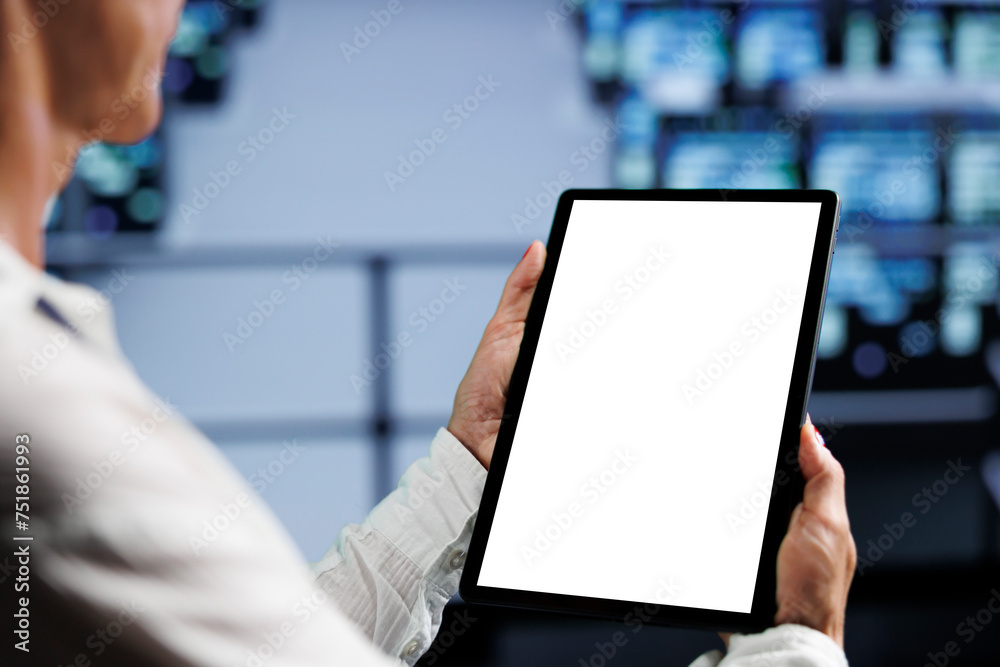 Poster close up shot of mock up tablet used by licensed it expert in data center using server rows to deliv