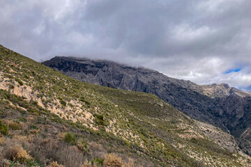 Panoramic view from hiking trail to Maroma peak in thunderstorm day, Sierra Tejeda, Spain 