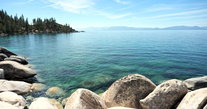 Scenic nature view over Lake Tahoe from the rocky boulders on shore in summer