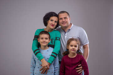 Fototapeta premium studio portrait of a happy family husband wife daughter and son 8