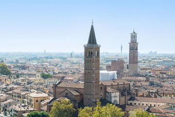 View of Tower of Basilica of Saint Anastasia and Lamberti Tower (Torre dei Lambert) in Verona city center; Veneto, Italy - obrazy, fototapety, plakaty
