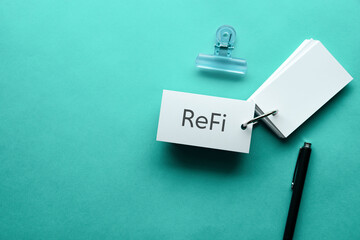 There is word card with the word ReFi. It is an abbreviation for ReFi Regenerative Finance as...