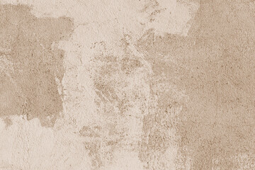 Old stucco plaster surface, concrete wall background, close up grunge texture of brown painted...