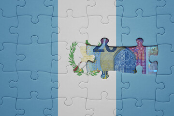 puzzle with the national flag of guatemala and euro banknote. finance concept