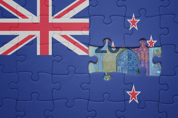 puzzle with the national flag of new zealand and euro banknote. finance concept