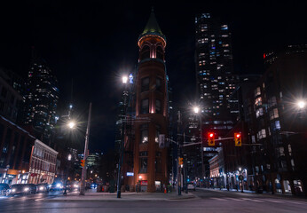 Night Toronto life - historical and contemporary downtown with streets ligthts. Black and white....