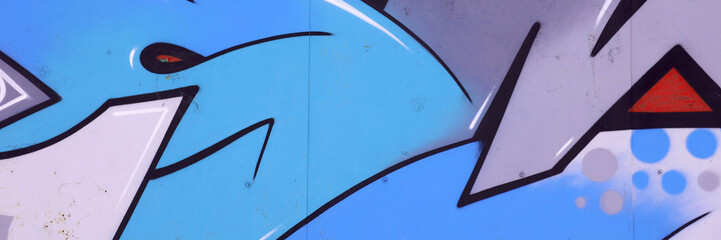 Colorful background of graffiti painting artwork with bright aerosol outlines on wall. Old school...