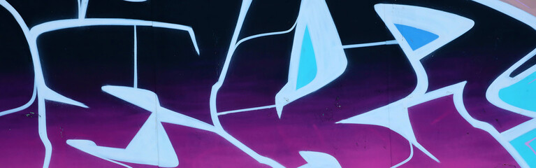 Colorful background of graffiti painting artwork with bright aerosol outlines on wall. Old school...