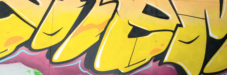 Colorful background of graffiti painting artwork with bright aerosol outlines on wall. Old school...