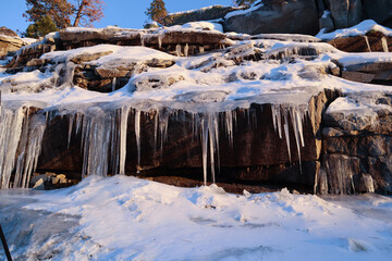 Icicles on the rock in winter. 