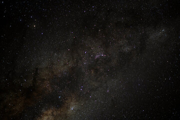 Looking at the night sky  with a milky way of stars and the cosmos in space.