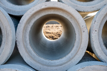 Concrete pipes with center hole resemble automotive tires