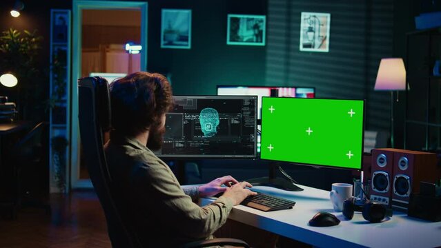 Programmer being asked existential questions by awaken AI on mockup PC gaining consciousness. Man communicating with artificial intelligence through green screen computer, camera B