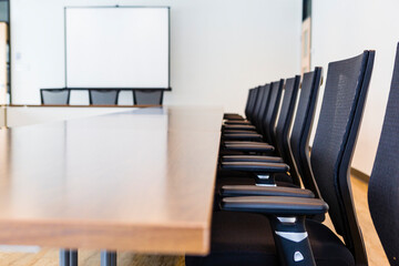 Conference Room with Screen and Chair in a Row
