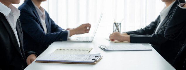 Two business executive in boardroom discuss term and company merging agreement, review corporate...