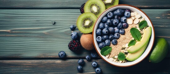 A bowl filled with a delicious and colorful breakfast ensemble, featuring fresh kiwis, plump blueberries, and crunchy granola. The vibrant mix of textures and flavors creates a satisfying and