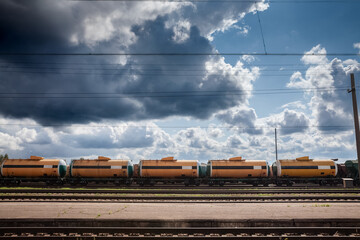 Selective blur on russian train tank cars & wagons containing gas & oil imported from russia, on freight yard cargo train station of Latvia in Jelgava. Energy & oil imports from Russia have decreased. - obrazy, fototapety, plakaty