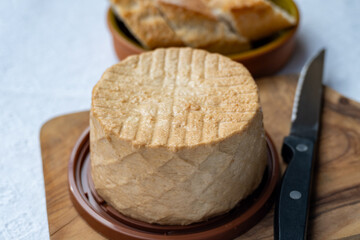 Cheese collection, piece of fresh smoked Spanish goat cheese close up