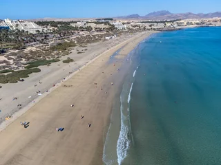 Photo sur Plexiglas Plage de Sotavento, Fuerteventura, Îles Canaries Aeriav view on sandy dunes, beach and Costa Calma, Fuerteventura, Canary islands, Spain in winter on sunset