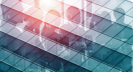 Double exposure image of faded business abstract background with office building and people conference group meeting showing partnership success of business deal. uds