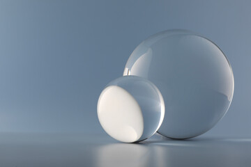 Transparent glass balls on light grey background. Space for text