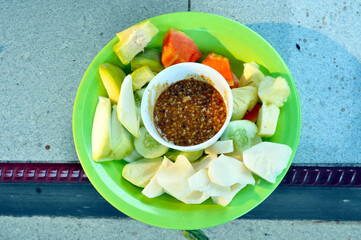 Fruit salad consists of papaya, mango and bangkoang with sweet chili sauce
