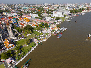 Pagoda at Wat Arun buddhist Temple of dawn a tourist landmark with Chao Phra Ya river aerial view - 751922943