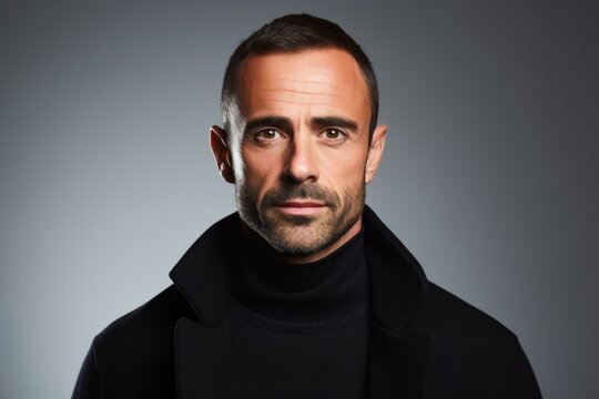 Handsome middle age man over grey background. Men's beauty, fashion.